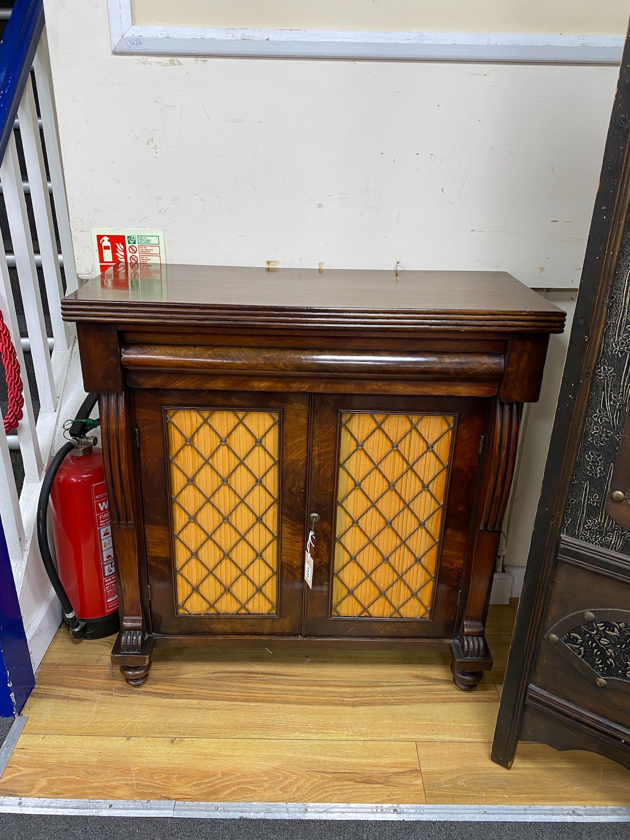 A William IV mahogany chiffonier, with pleated silk and brass grille doors, height 89cm, width 84cm, depth 35cm